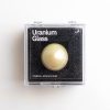 BOULE EN VERRE D'URANIUM DANS SA BOÎTE DE COLLECTIONNEUR